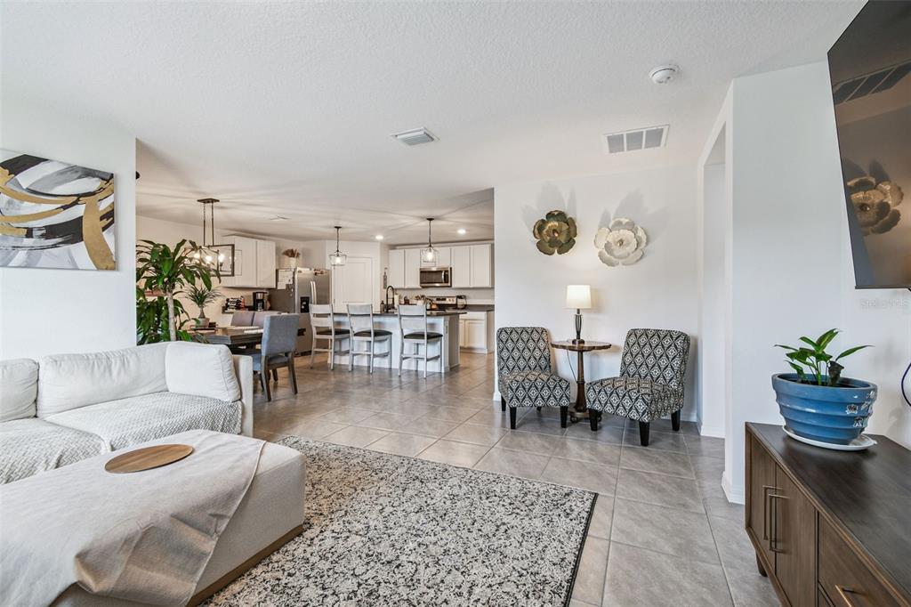 3139 Silver Date Drive Wimauma, FL 33598 - Photo 14 of 47 a living room with furniture and wooden floor