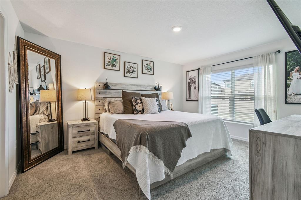 3139 Silver Date Drive Wimauma, FL 33598 - Photo 16 of 47 a bedroom with a bed and a large window