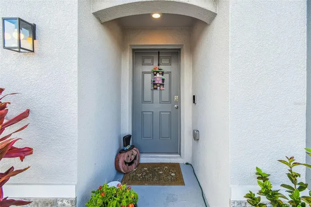 a kitchen with stainless steel appliances granite countertop a refrigerator a sink a stove top oven a counter space and cabinets