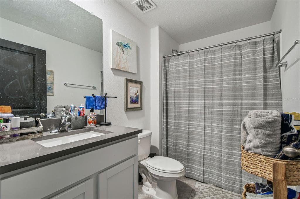 3139 Silver Date Drive Wimauma, FL 33598 - Photo 25 of 47 a bathroom with a sink toilet and shower
