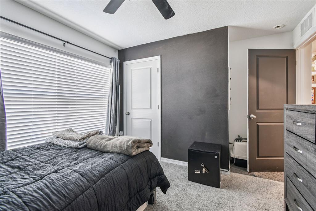 3139 Silver Date Drive Wimauma, FL 33598 - Photo 29 of 47 a bedroom with a bed and a cabinets