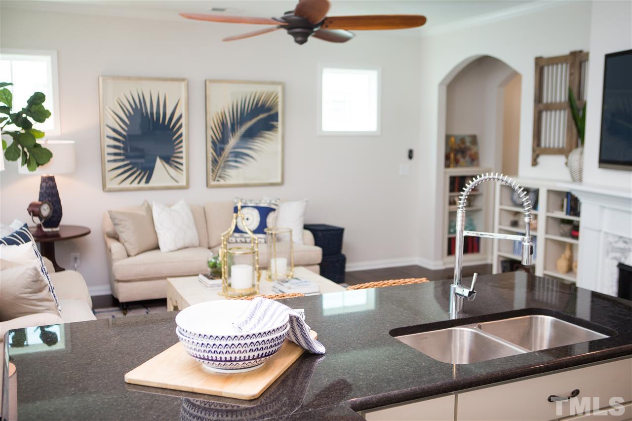 5305 Beckom Street, Unit TAYLOR I Raleigh, NC 27616 - Photo 4 of 15 Enjoy cooking while your guests are relaxing in the family room.This is a photo of the model.