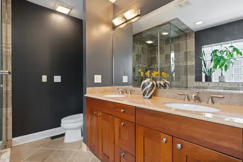 a bathroom with a double vanity sink and a mirror