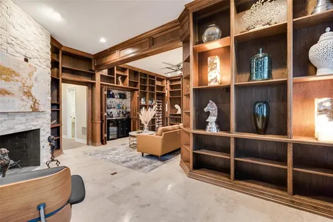 a large white kitchen with a large island oven and a sink