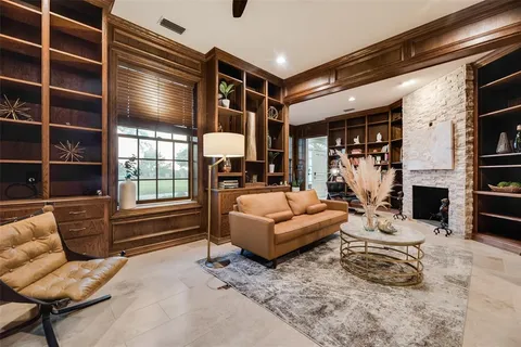a kitchen with stainless steel appliances kitchen island granite countertop a stove and a refrigerator