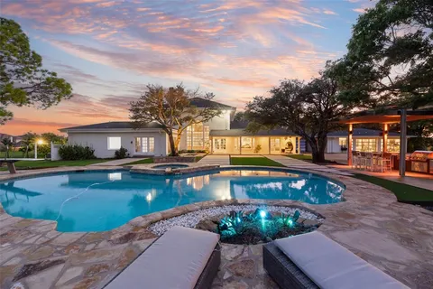 a view of a swimming pool with a patio