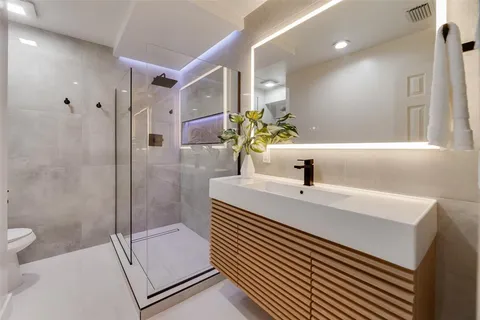 a bathroom with a sink and mirror