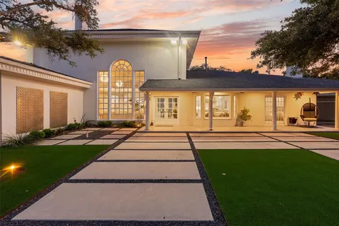 a view of a yard with large trees