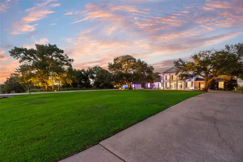 a bathroom with a glass shower door and a bathtub