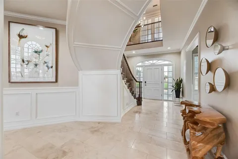 a view of a hallway with paintings on the wall
