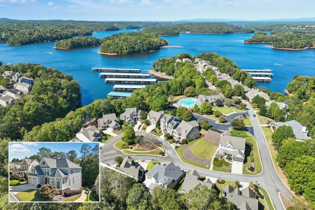 an aerial view of a house with garden space and lake view