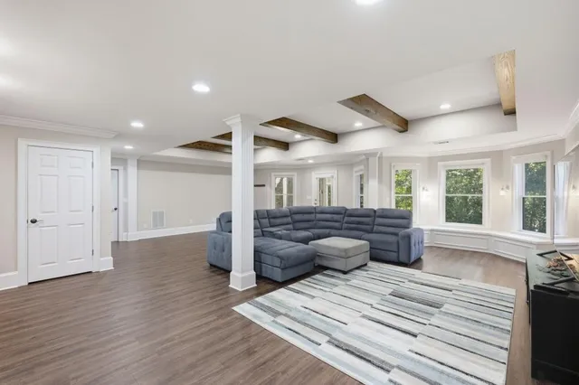 a bedroom with a bed and glass windows