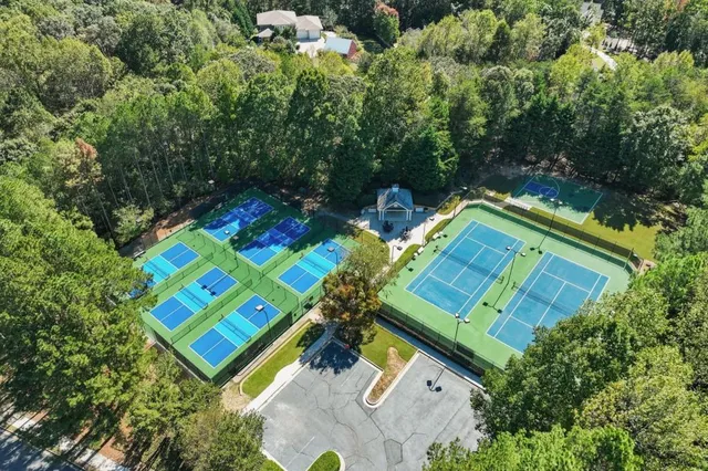 an aerial view of a house with a yard