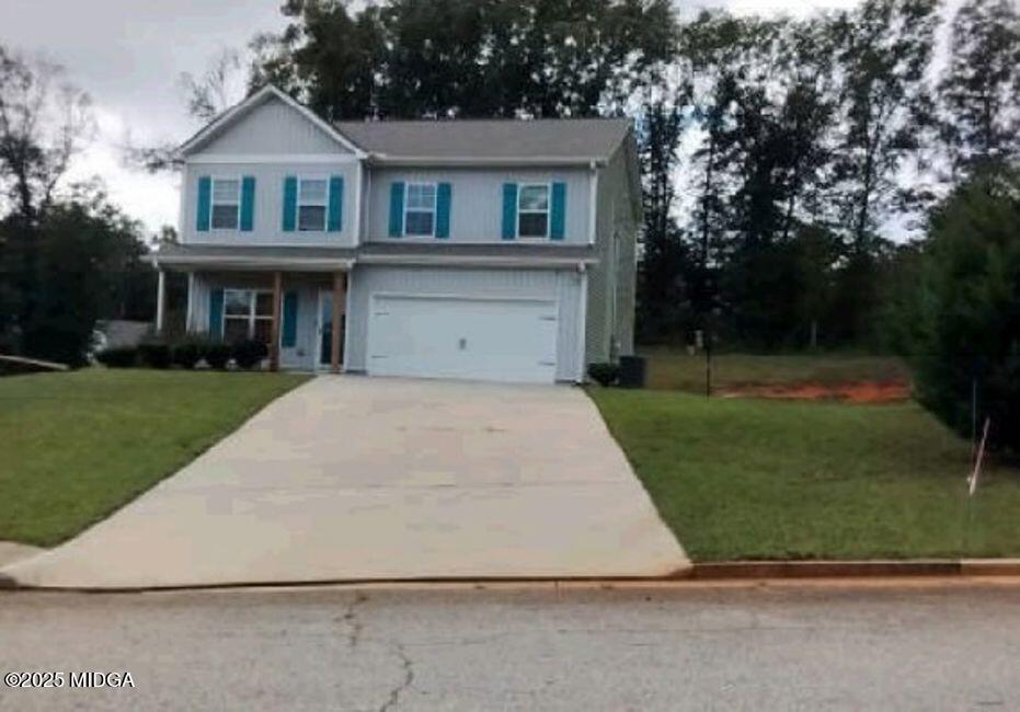a front view of a house with a yard