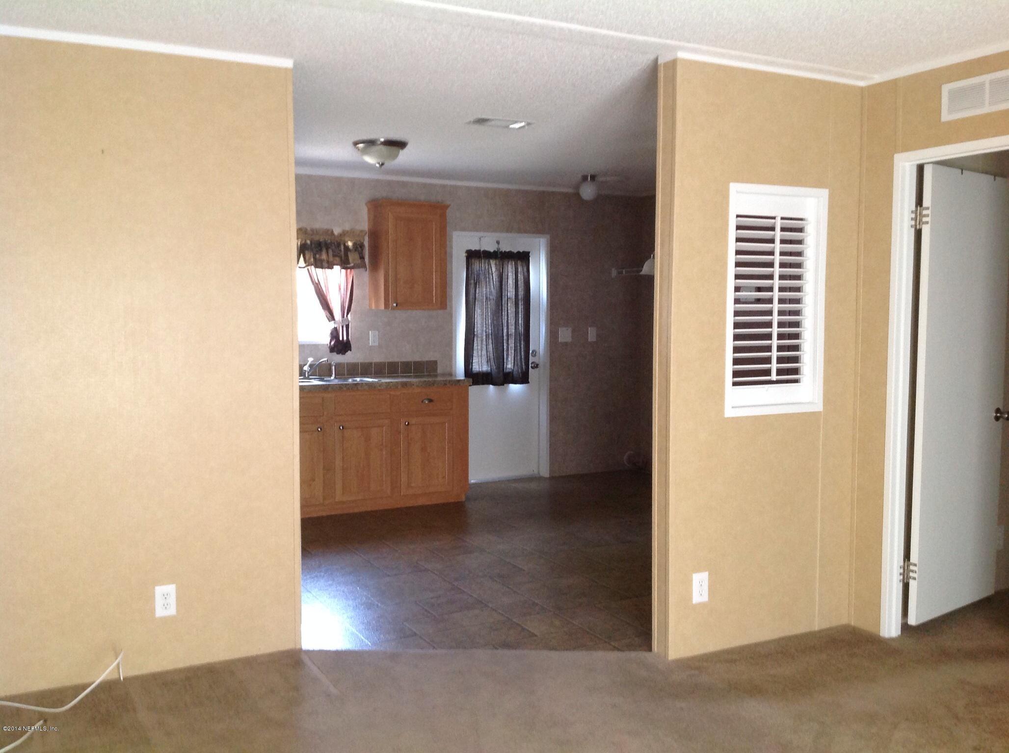 111 Stallion Road Crescent City, FL 32112 - Photo 17 of 21 Living into kitchen 2