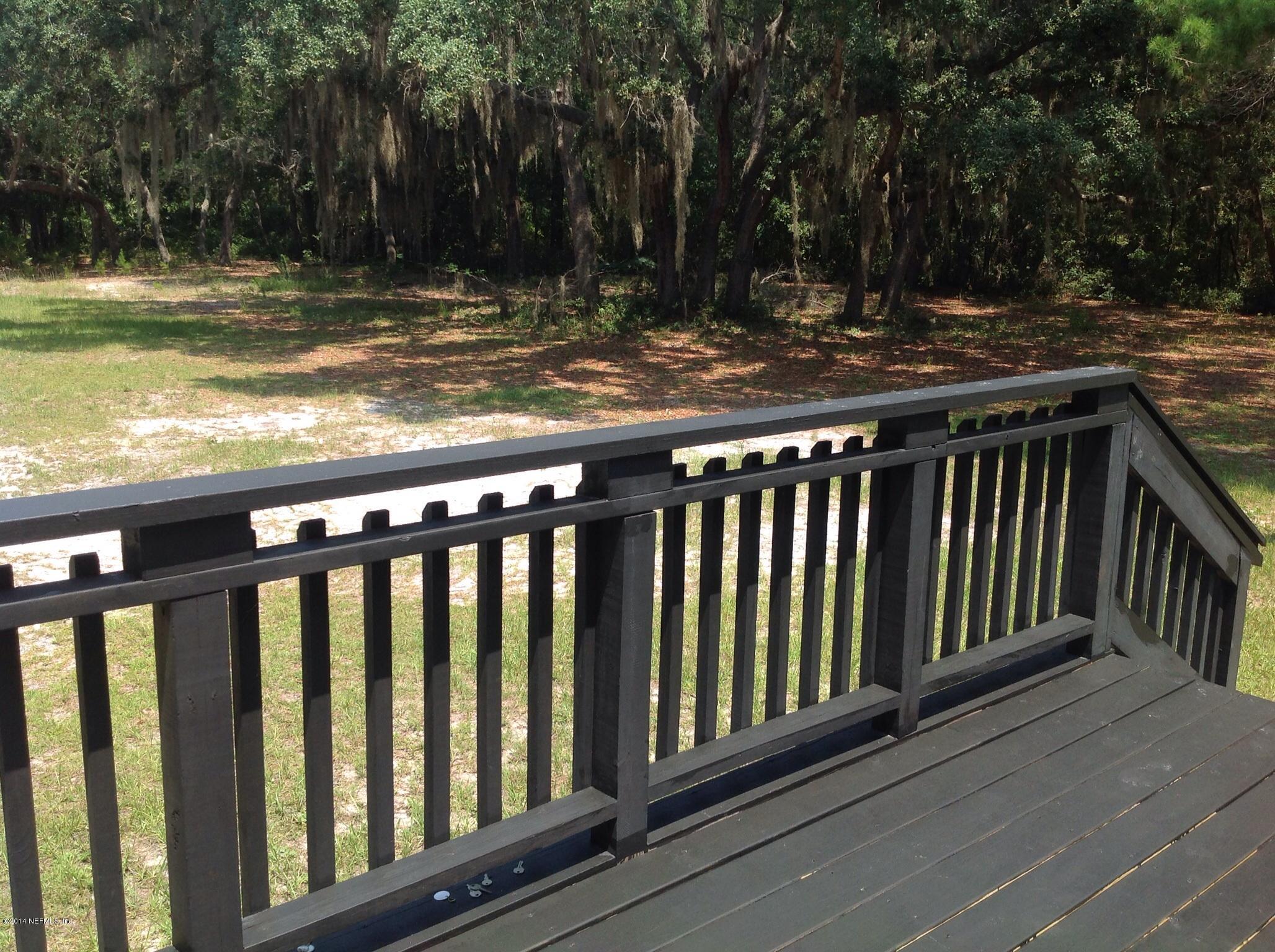 111 Stallion Road Crescent City, FL 32112 - Photo 7 of 21 View of backyard from deck