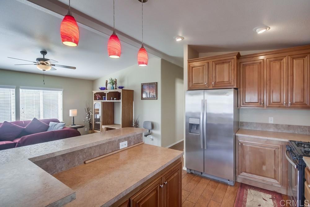 8545 Mission Gorge Road, Unit SPC 232 Santee, CA 92071 - Photo 14 of 30 a kitchen with stainless steel appliances granite countertop a sink and a refrigerator