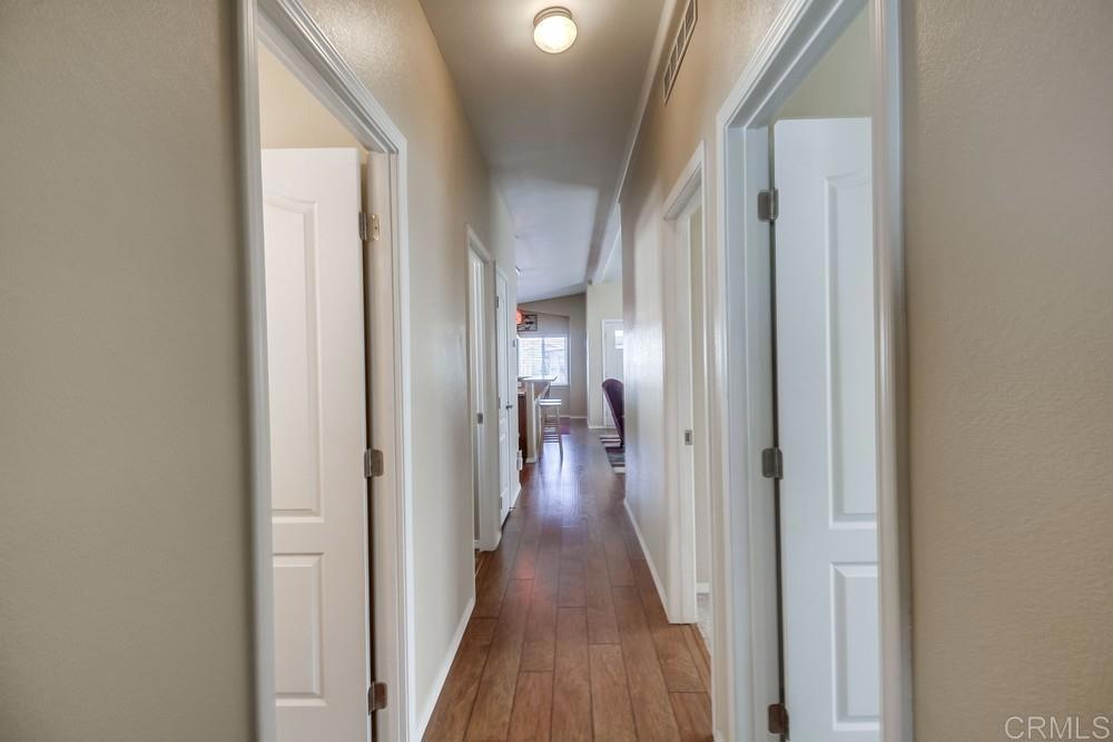8545 Mission Gorge Road, Unit SPC 232 Santee, CA 92071 - Photo 21 of 30 a view of a hallway with wooden floor and staircase