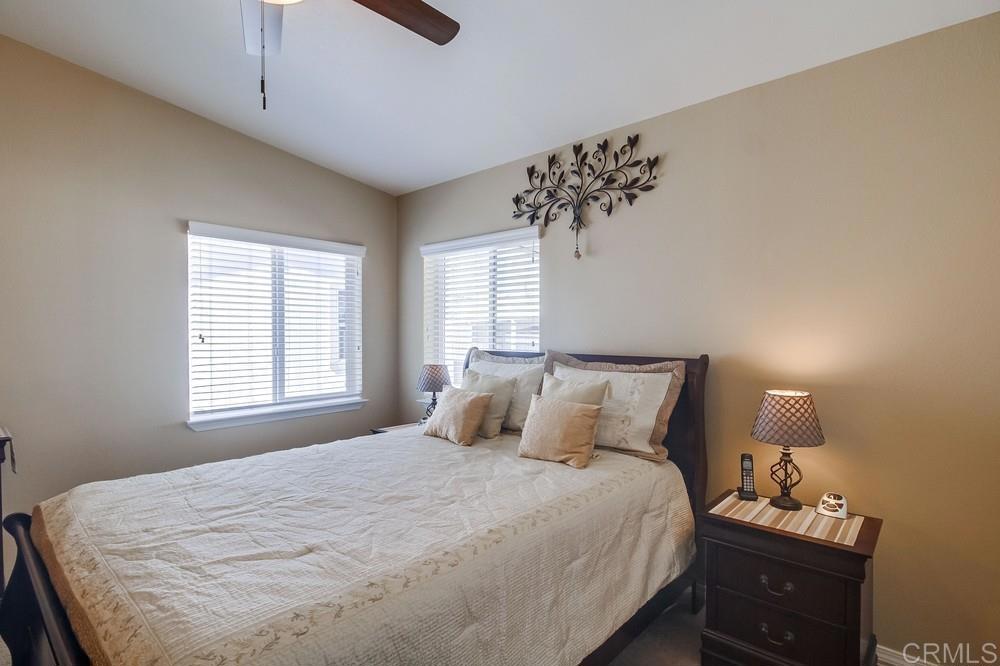 8545 Mission Gorge Road, Unit SPC 232 Santee, CA 92071 - Photo 22 of 30 a bedroom with a bed and a window
