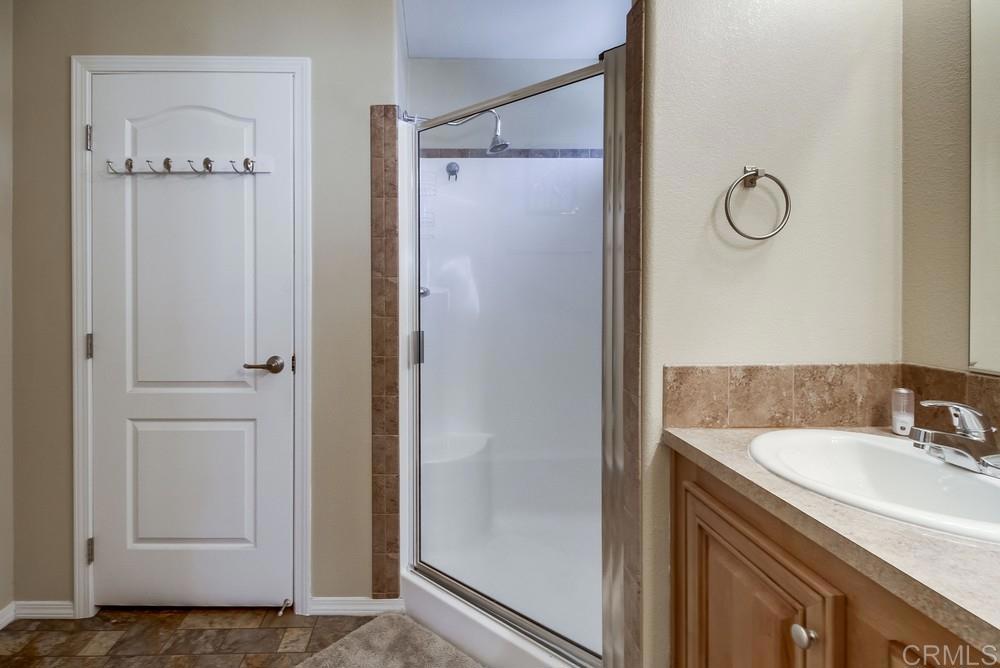 8545 Mission Gorge Road, Unit SPC 232 Santee, CA 92071 - Photo 27 of 30 a bathroom with a shower sink and mirror