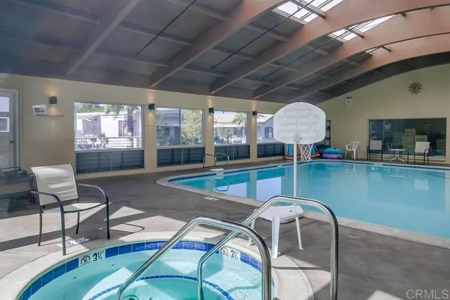 a room with lots of chairs and pool table