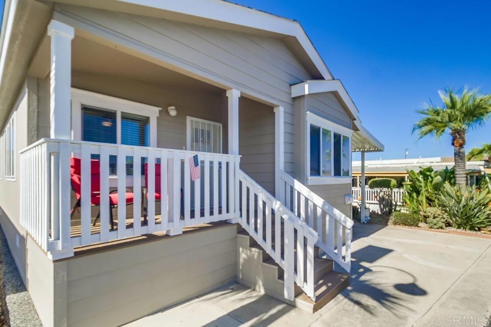 8545 Mission Gorge Road, Unit SPC 232 Santee, CA 92071 - Photo 3 of 30 a view of building with glass door and deck