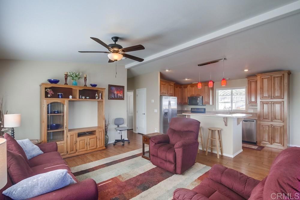 8545 Mission Gorge Road, Unit SPC 232 Santee, CA 92071 - Photo 7 of 30 a living room with furniture a ceiling fan and a window