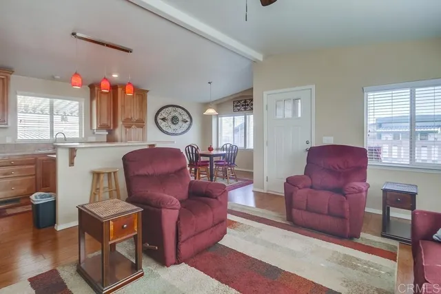 a living room with furniture bathtub and window
