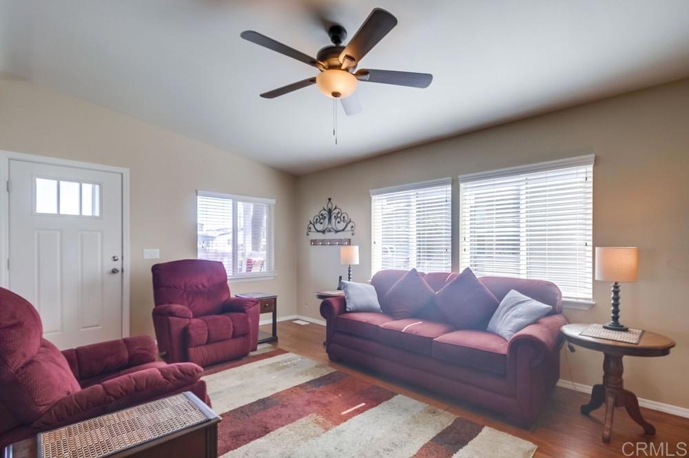 8545 Mission Gorge Road, Unit SPC 232 Santee, CA 92071 - Photo 9 of 30 a living room with furniture a ceiling fan and a window
