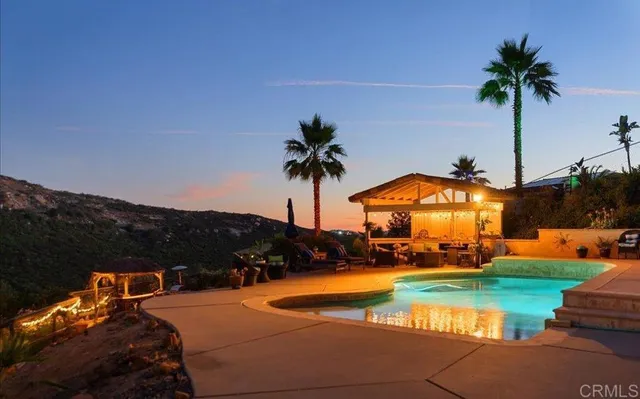 a view of a swimming pool with lounge chair