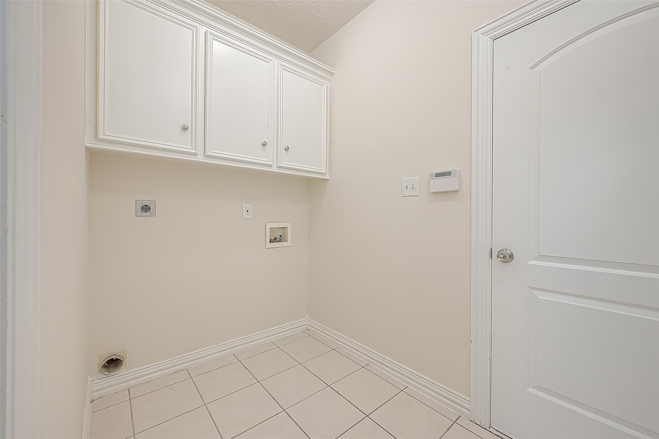 1189 Lovett Street Tomball, TX 77375 - Photo 23 of 36 a view of cabinets and utility room