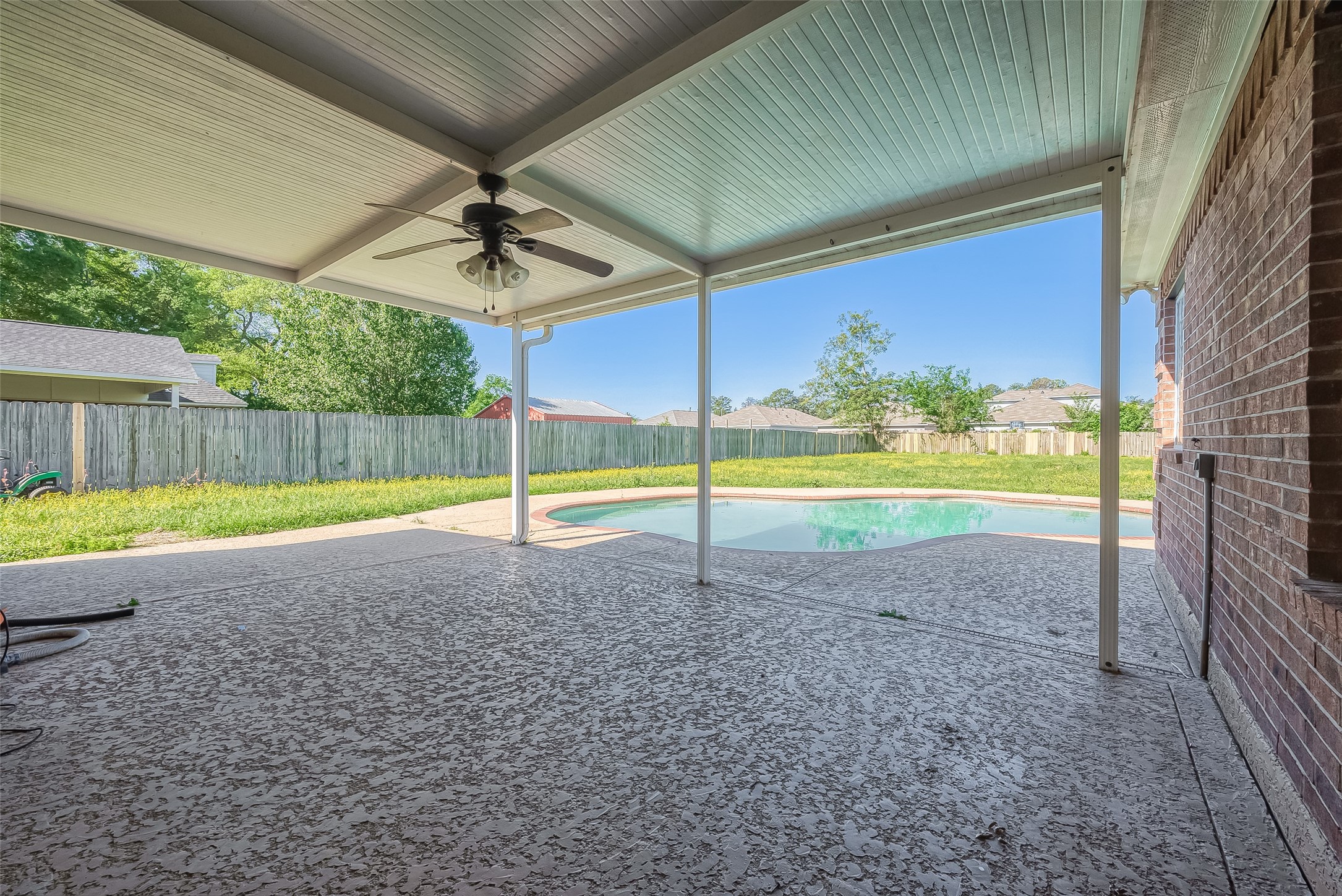 1189 Lovett Street Tomball, TX 77375 - Photo 30 of 36 a view of a backyard with swimming pool