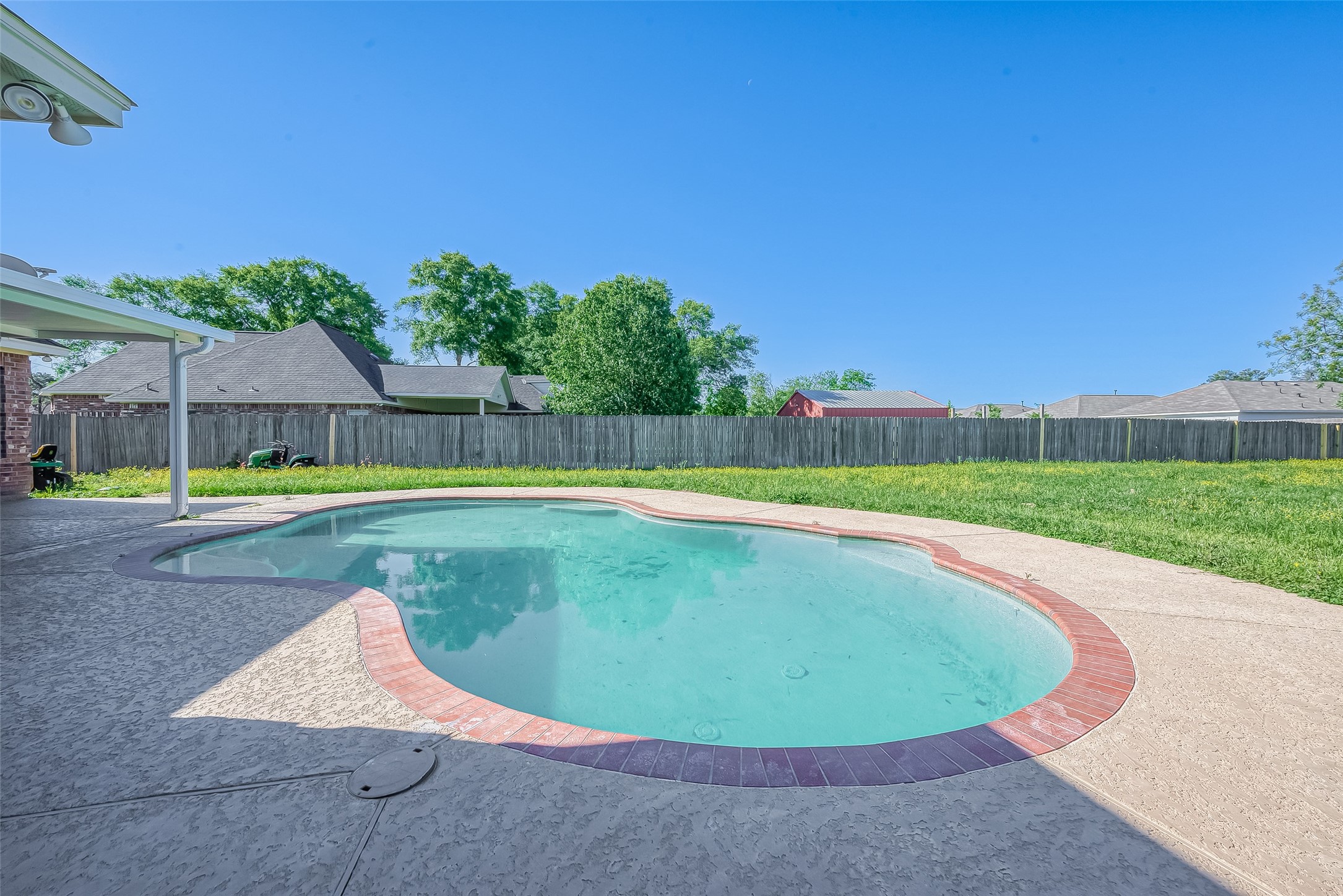 1189 Lovett Street Tomball, TX 77375 - Photo 34 of 36 a view of a swimming pool and a yard