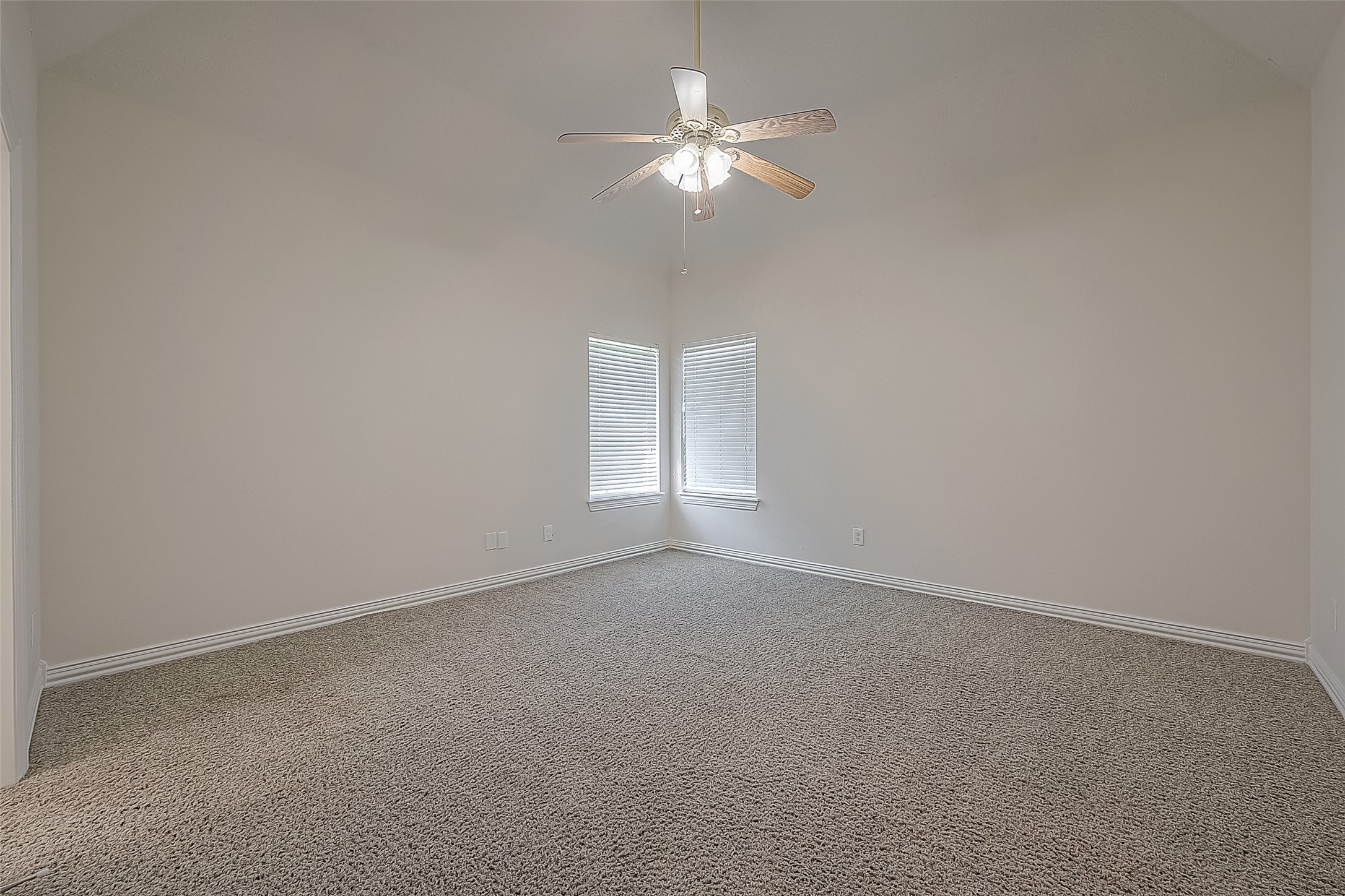 1189 Lovett Street Tomball, TX 77375 - Photo 6 of 36 a view of an empty room with a chandelier fan