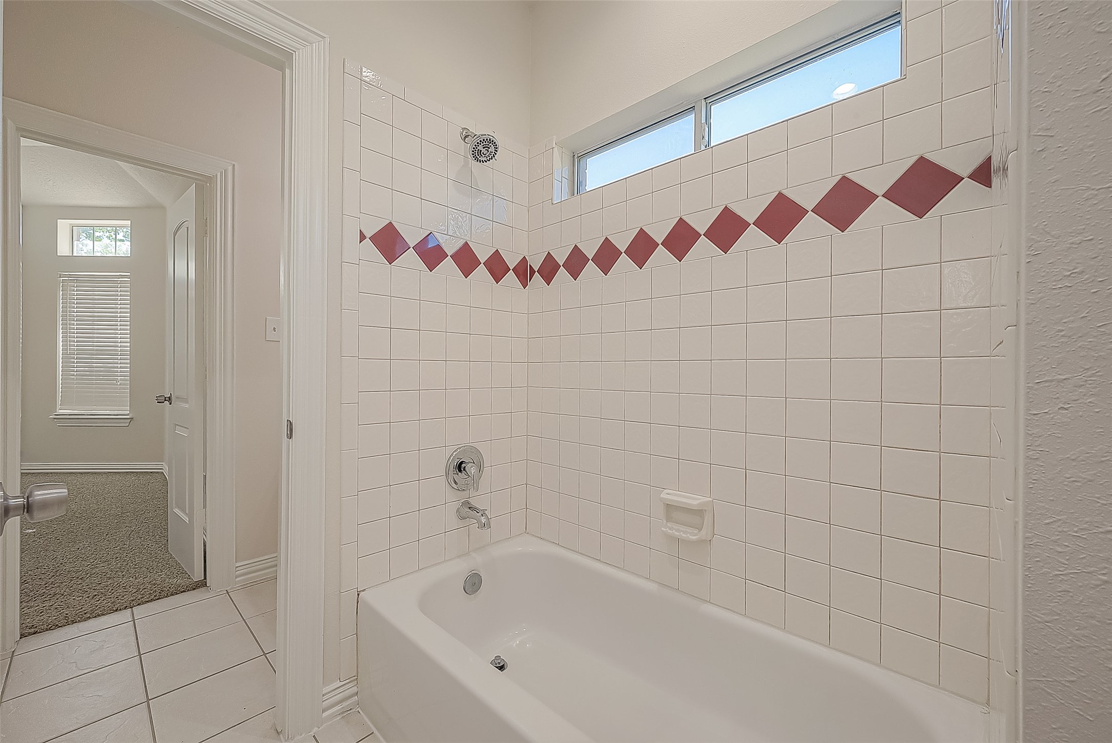 1189 Lovett Street Tomball, TX 77375 - Photo 9 of 36 a bathroom with a bathtub and shower