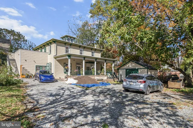 a front view of a house with large windows