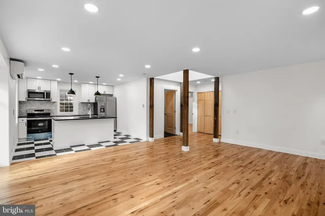 a view of kitchen with wooden floor