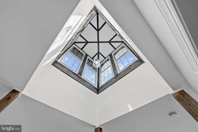a bathroom with a double vanity sink toilet and shower