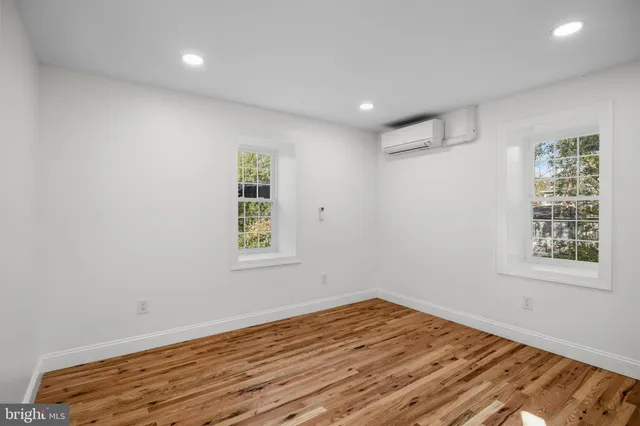 a view of a room with wooden floor and closet