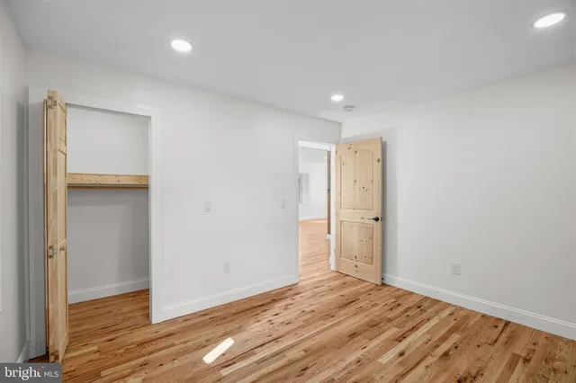 a house that has a tree in front of it