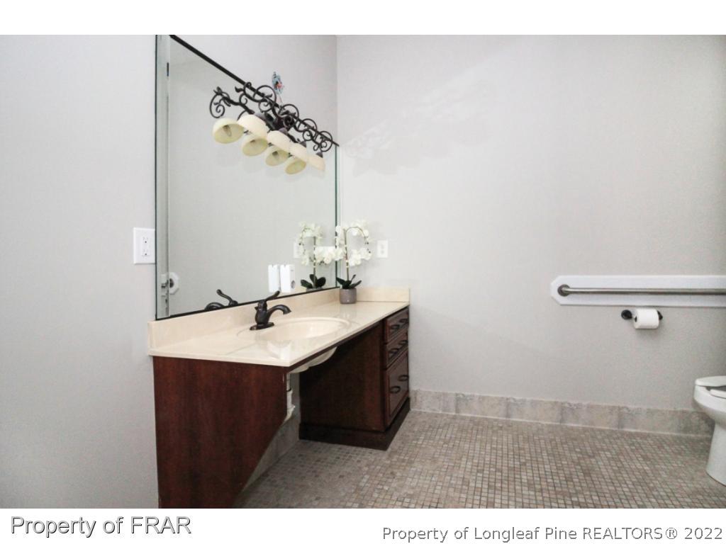 384 Booth Pond Road Raeford, NC 28376 - Photo 26 of 35 a bathroom with a sink and a mirror