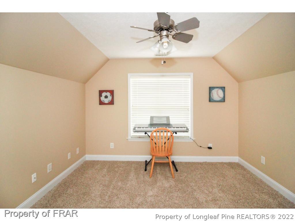 384 Booth Pond Road Raeford, NC 28376 - Photo 27 of 35 a chair and a table in a room