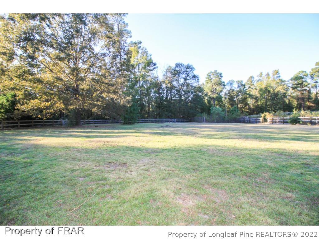 384 Booth Pond Road Raeford, NC 28376 - Photo 33 of 35 a view of outdoor space and swimming pool