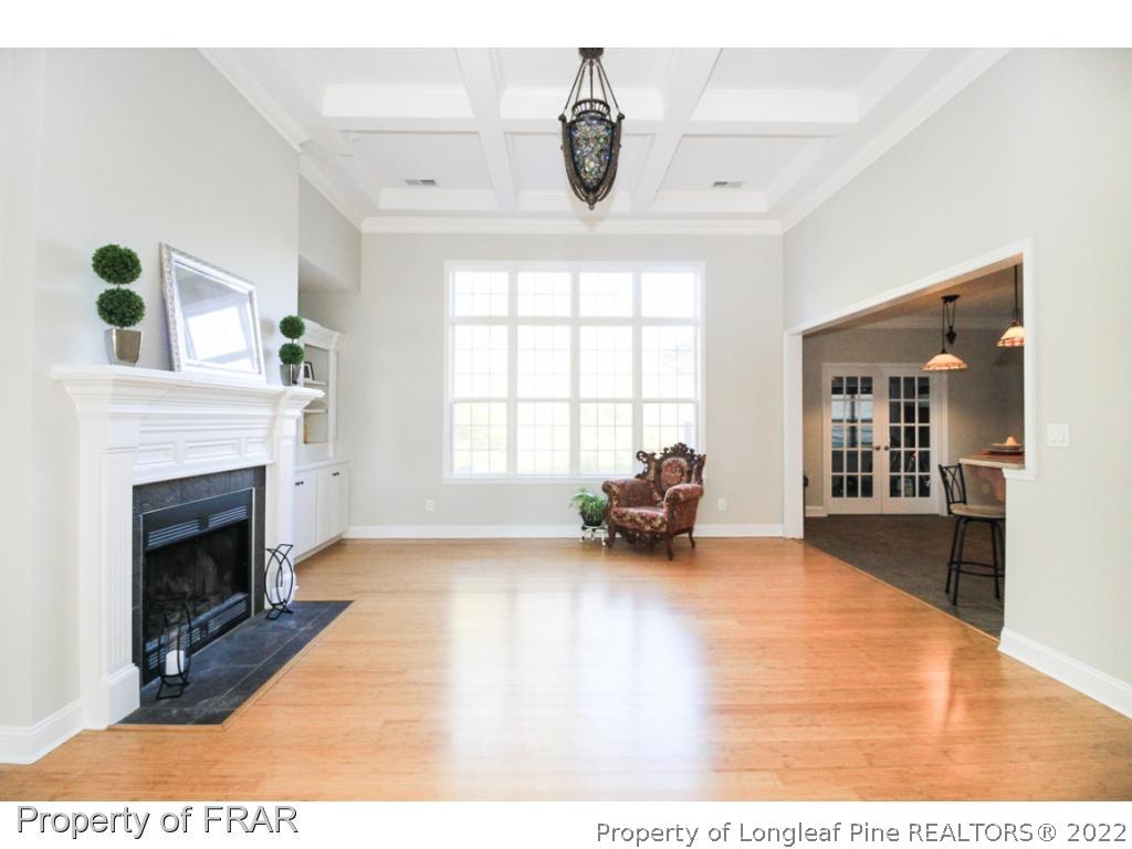 384 Booth Pond Road Raeford, NC 28376 - Photo 5 of 35 a living room with furniture and a fireplace