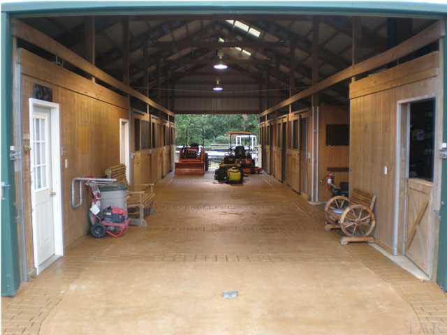 5170 Annie Ruth Street Milton, FL 32570 - Photo 18 of 24 Nice Large 40x72 Morton Barn featuring 8 Stalls, Tack Room, Workshop and Bathroom