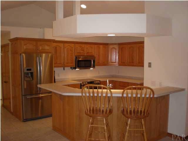 Main House Kitchen with lots of Cabinets and Stainless Appliances