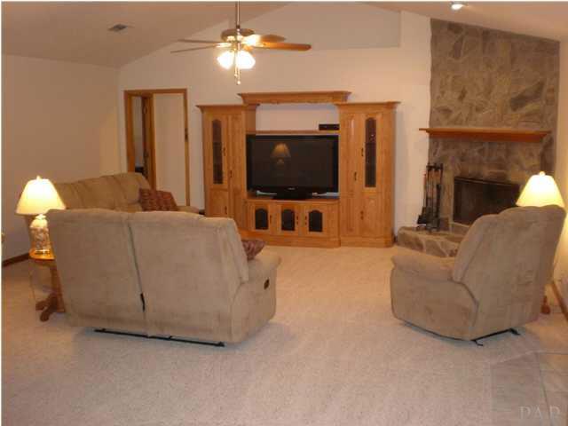 Main House Great Room featuring Stone Fireplace and Plant Ledges