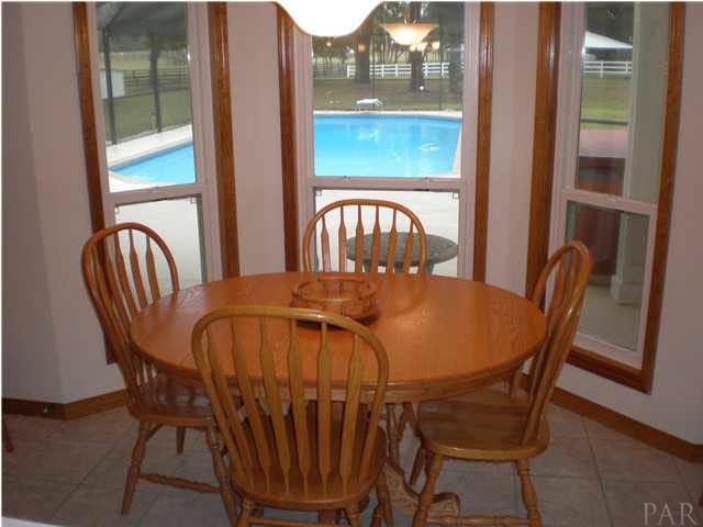 5170 Annie Ruth Street Milton, FL 32570 - Photo 8 of 24 Main House Breakfast Nook Overlooking Pool Area