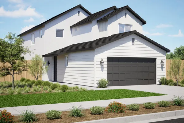 a view of a house with a yard and garage