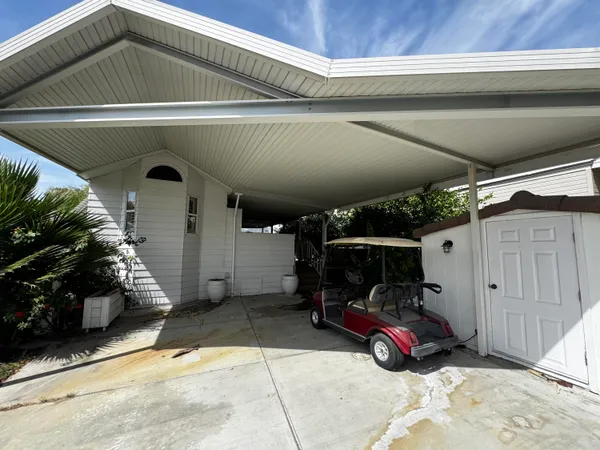 a view of parking garage with cars